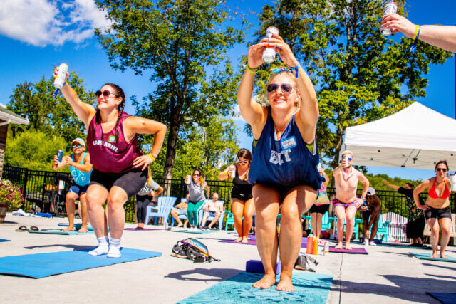 A group of women doing yoga outdoors