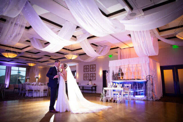 Bride and groom in the SeaStar Ballroom at Atlantis Banquets & Events.