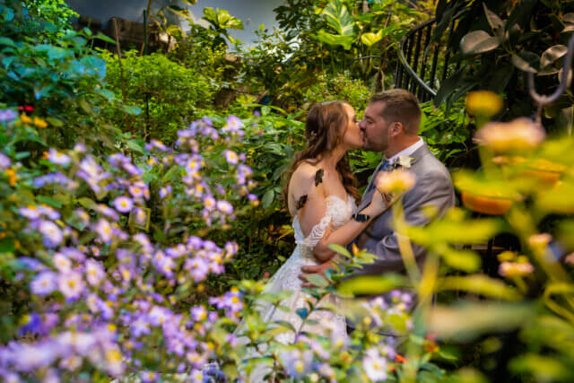 Couple inside the Butterfly Experience at Atlantis Banquets & Events.
