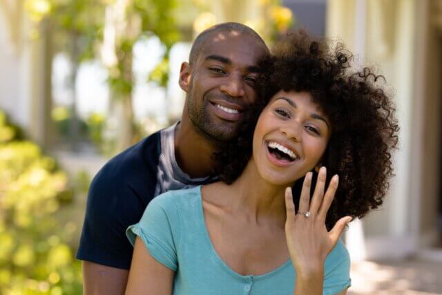 a man and woman smiling