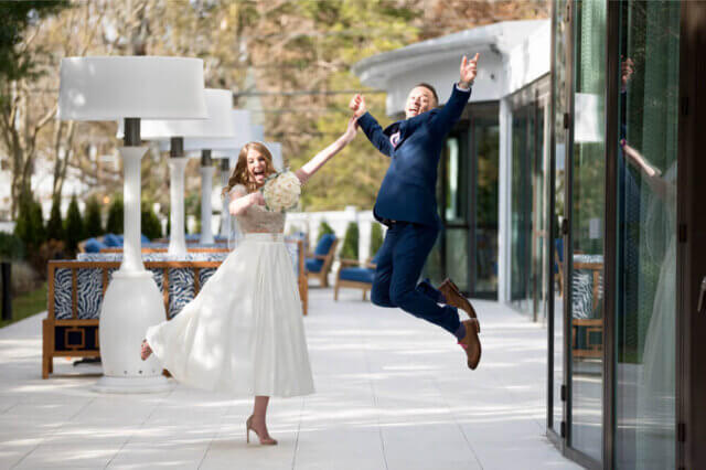 a man and woman jumping in the air