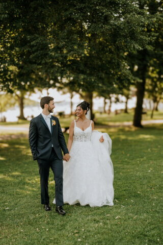 bride and groom in a field