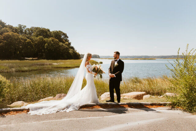 A bride and groom near the water