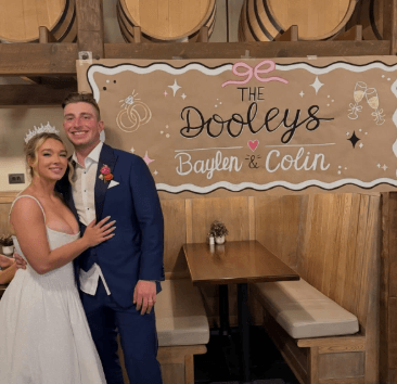 A bride and groom smiling
