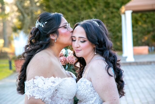 A bride kissing her bride