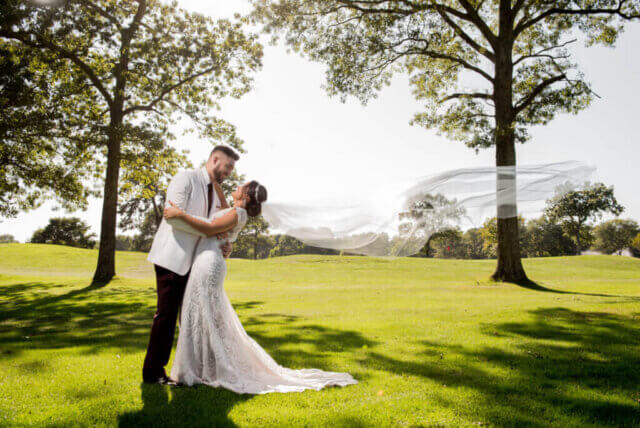 A wedding couple on a golf course