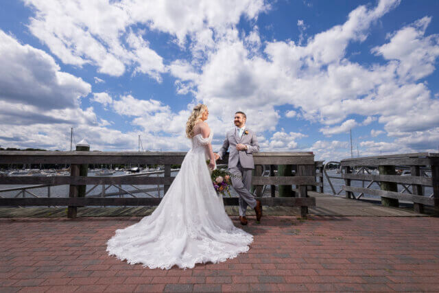 Bride and groom on a dock