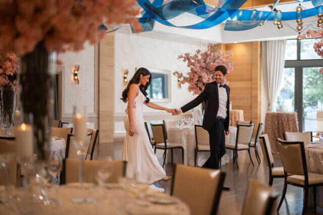 Bride and groom being playful in a dining room